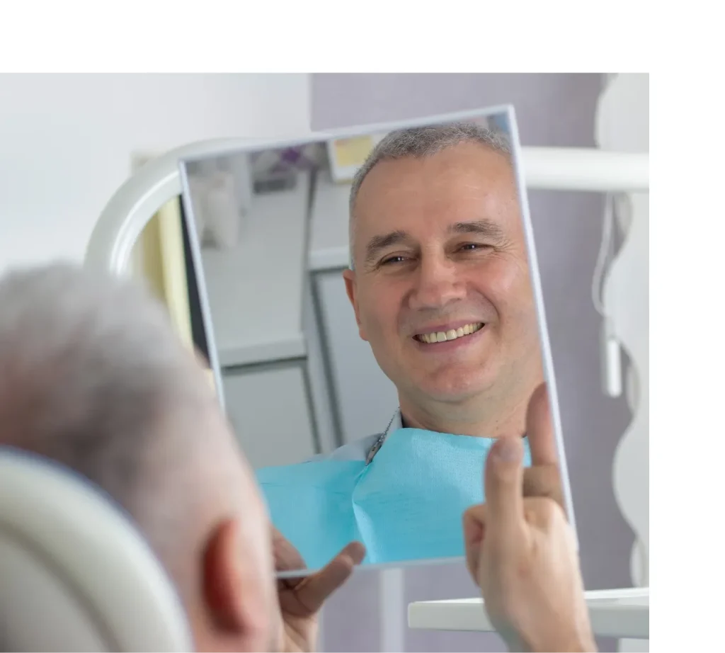 happy client with implants by Dr Raghu